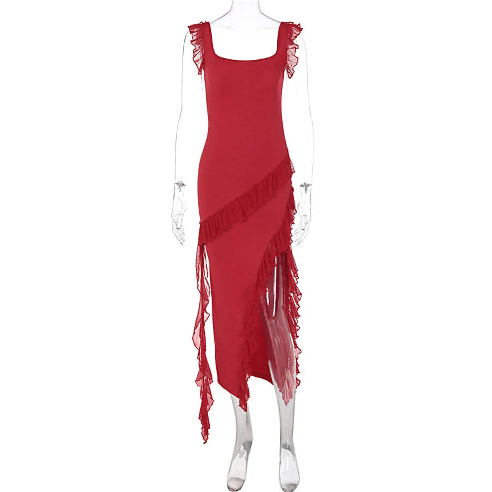 Elegant satin slip dress with ruffle detailing and thigh-high slit, available in various colours and sizes.