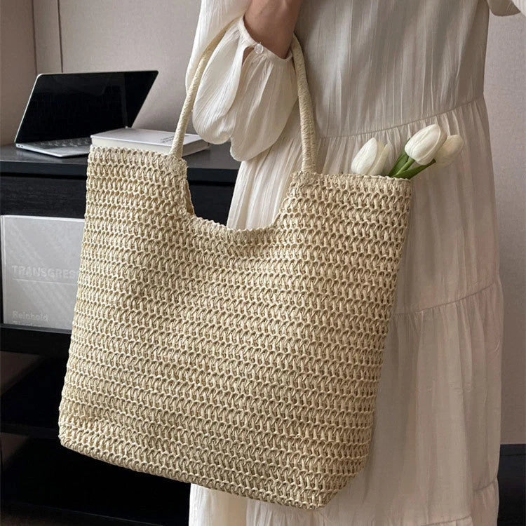 A stylish and spacious straw tote bag in brown and beige colours, perfect for British women on the go.