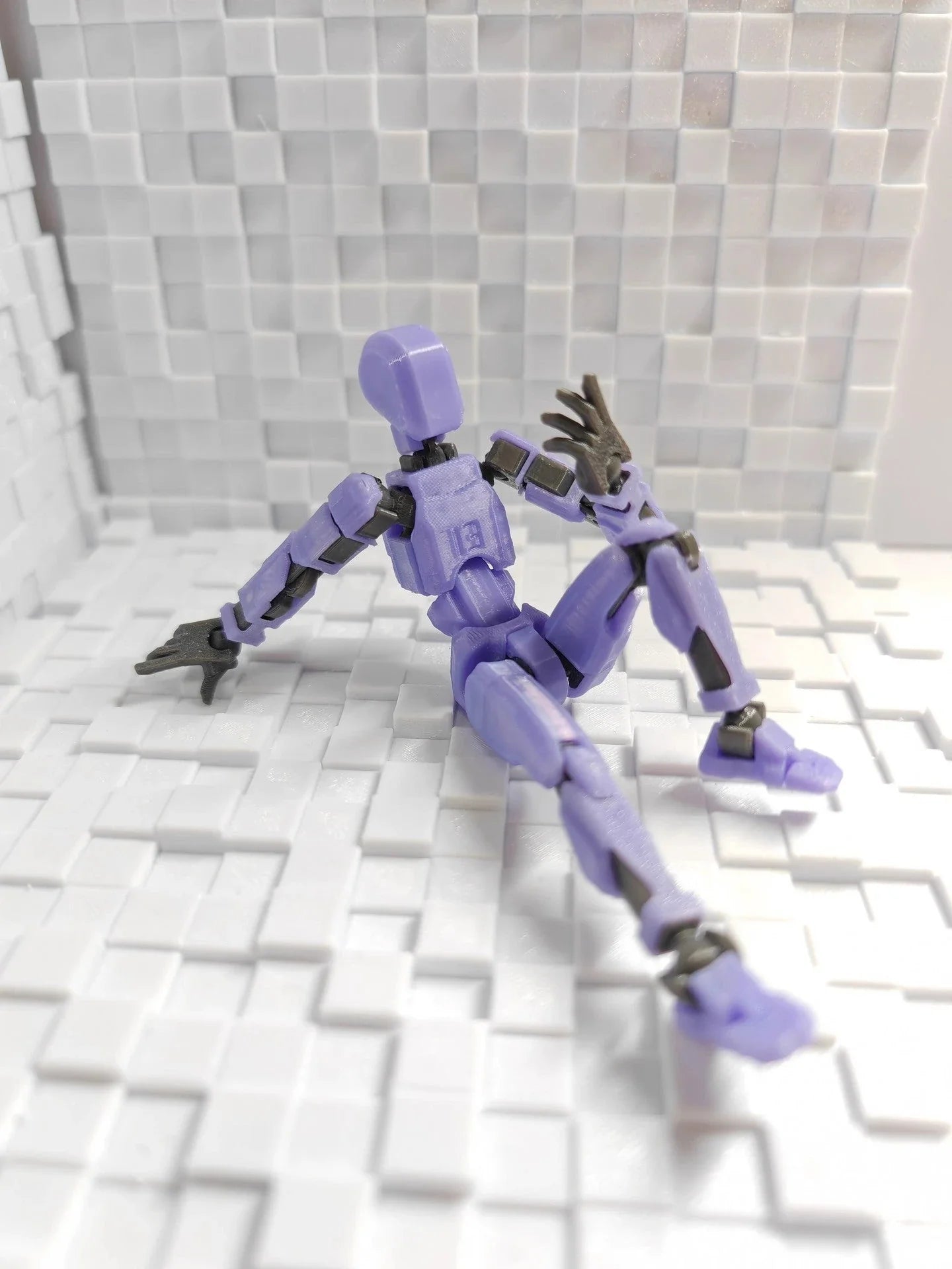 Poseable 3D-printed transforming robot action figure toy in various bright colors