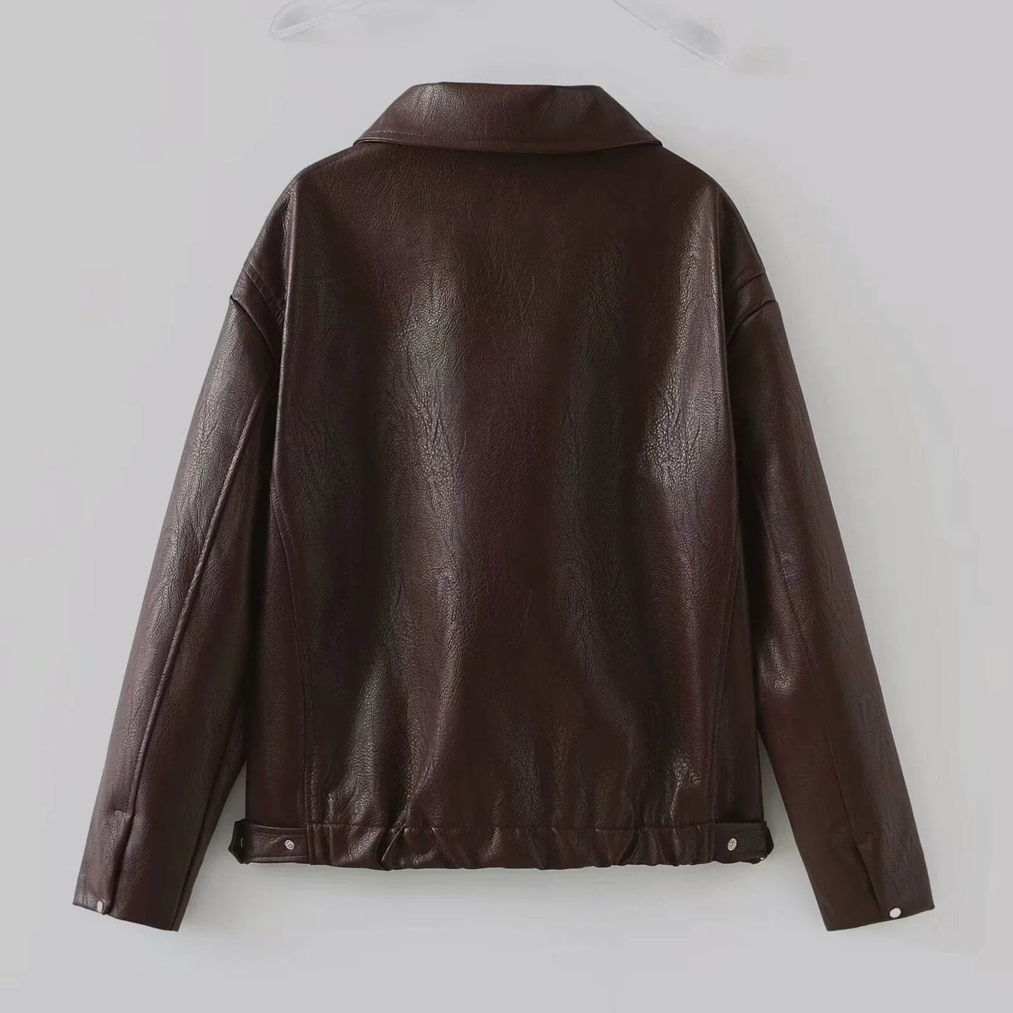 Fashionable faux leather jacket in burgundy and black colors, featuring a zipper closure and long sleeves for casual, versatile wear