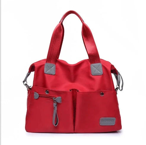 Versatile ladies shoulder bag with multiple carry options, numerous pockets, and durable Oxford fabric construction