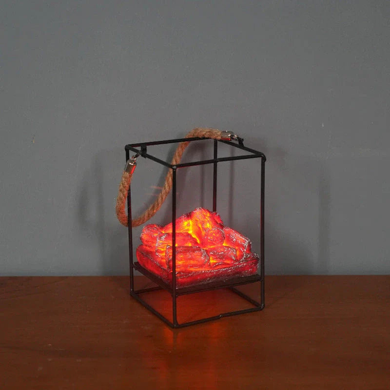 A charcoal-coloured fireplace lamp with a mesmerising LED flame effect, creating a cosy and inviting atmosphere in a living room.