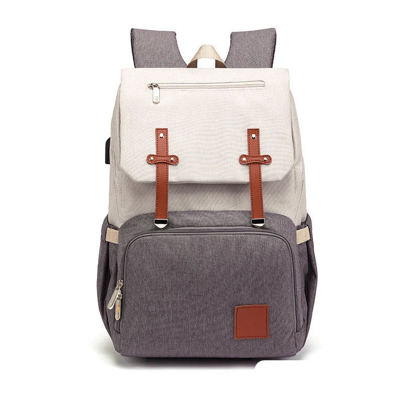 Versatile mummy bag with stroller hooks, side pockets, and zippered compartments for storing baby essentials