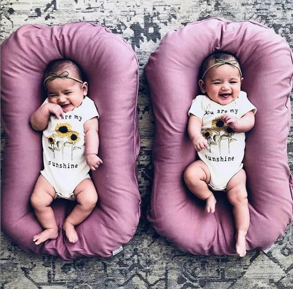 Portable baby nest crib with cotton cover for newborns, dimensions 75cm by 45cm