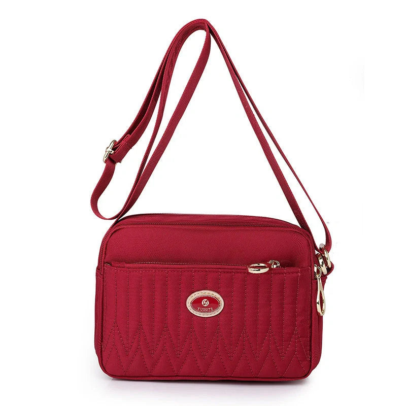 Women's lightweight nylon cross body messenger bag in various colours