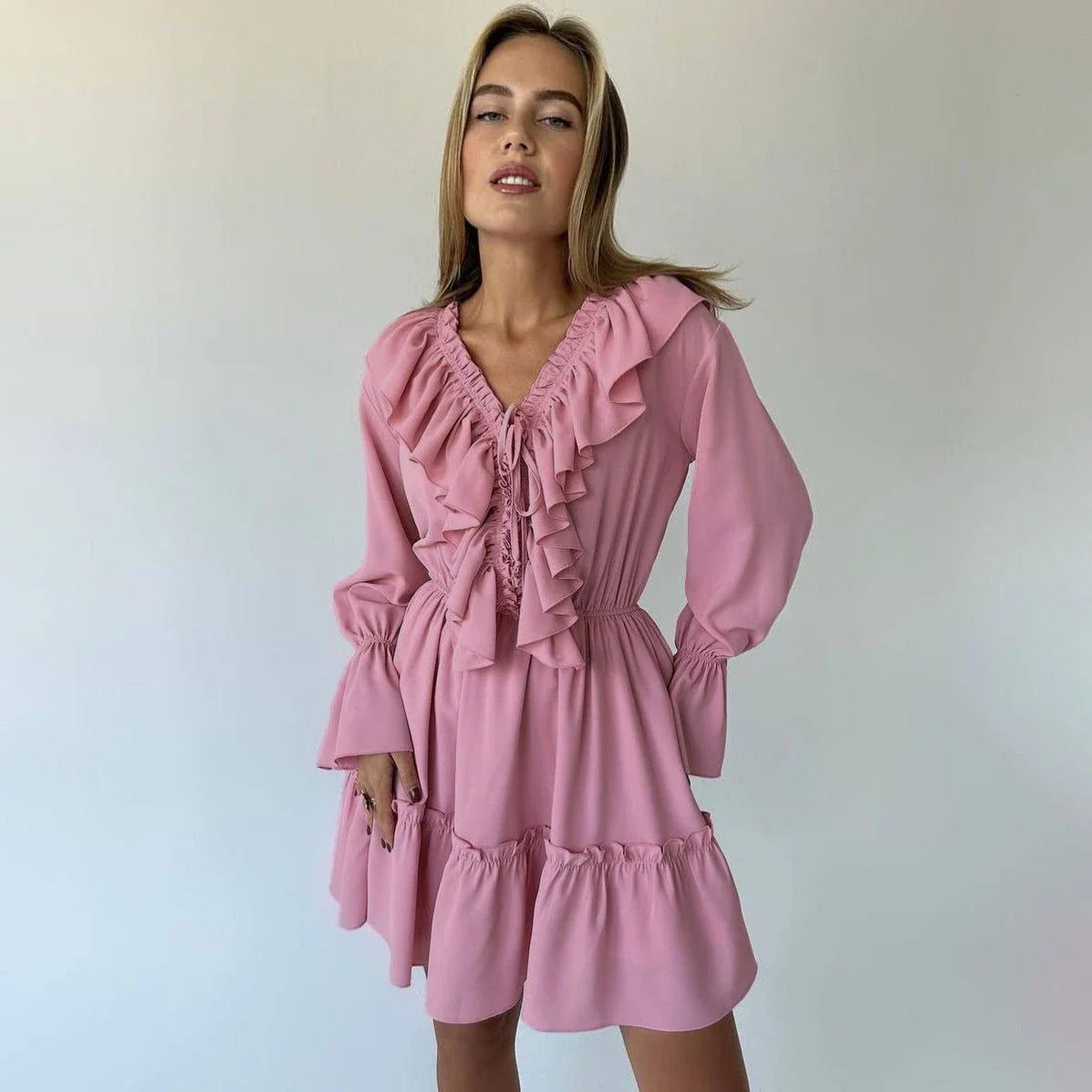 Stylish Y2K-inspired viscose dress with v-neck and flared sleeves, available in a range of vibrant colors
