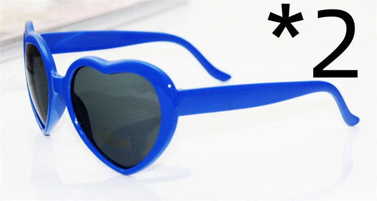 Stylish heart-shaped sunglasses with unique lens design that transforms light into enchanting special effects