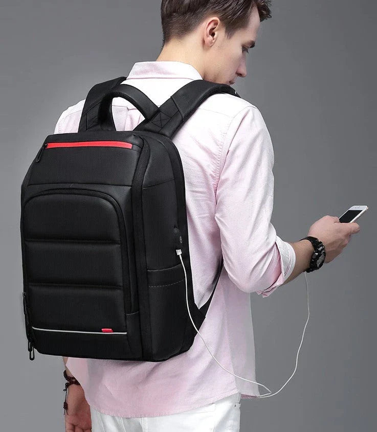 Waterproof backpack with USB charging port, multiple compartments, and comfortable padded straps for everyday use and travel
