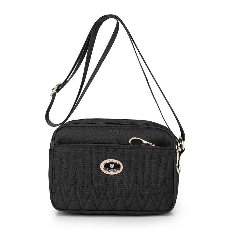 Women's lightweight nylon cross body messenger bag in various colours