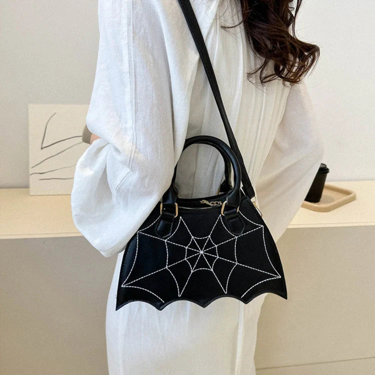 Trendy spider web-patterned shoulder bags in various colours, perfect for adding a spooky-chic touch to your Halloween outfit