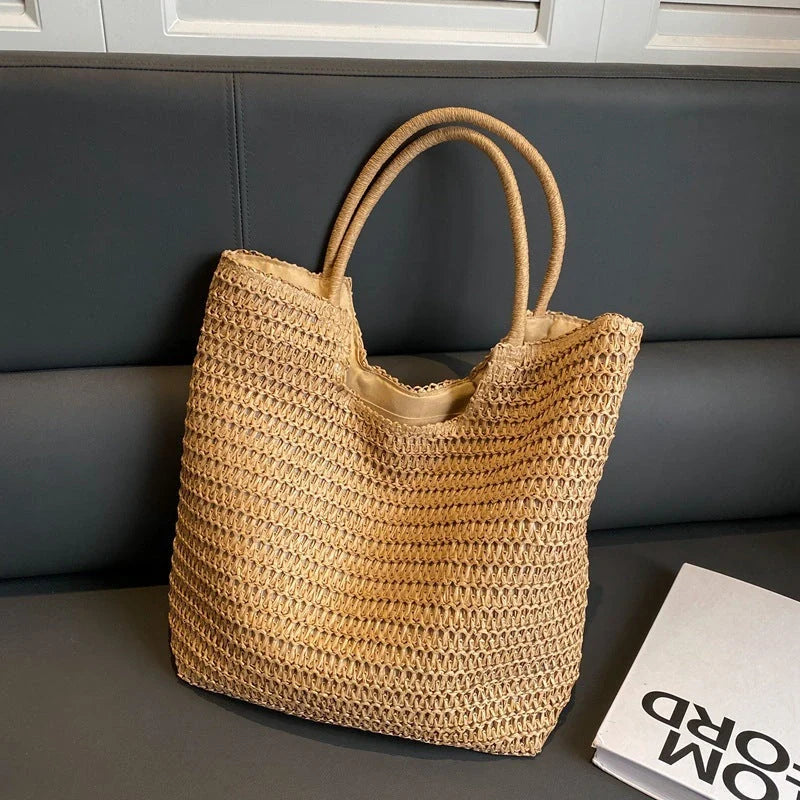 A stylish and spacious straw tote bag in brown and beige colours, perfect for British women on the go.