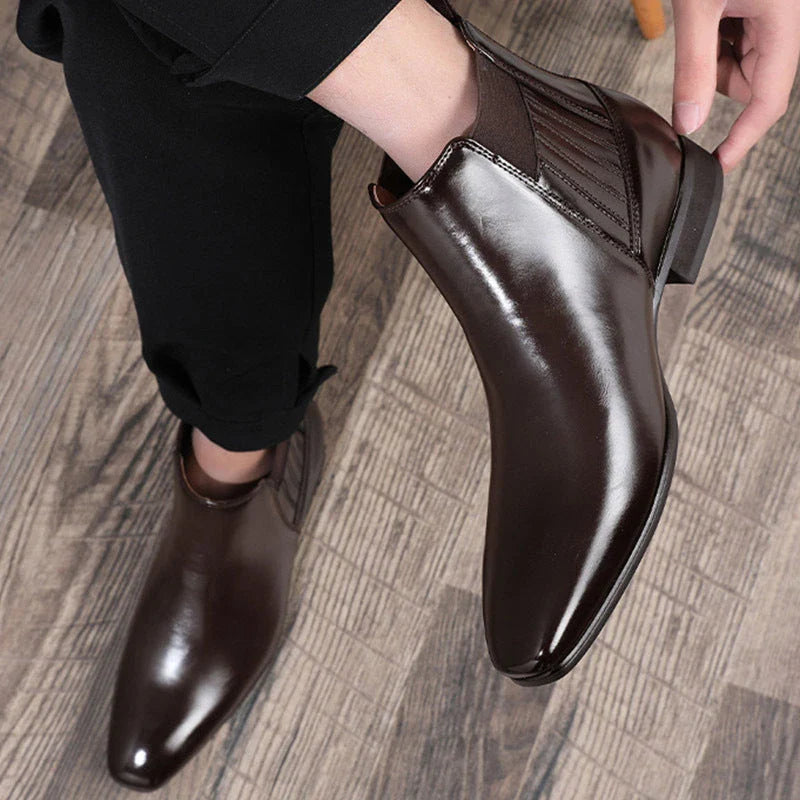Stylish pointed toe Chelsea boots for men in black and brown colors, featuring a square heel and British-inspired design.