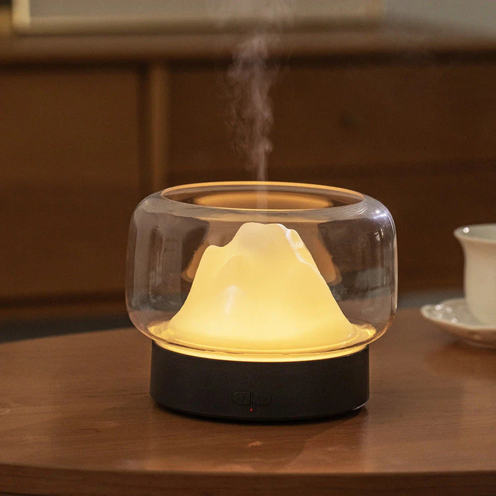 Premium aroma diffuser with serene mountain landscape design and multi-coloured night light for relaxation and well-being