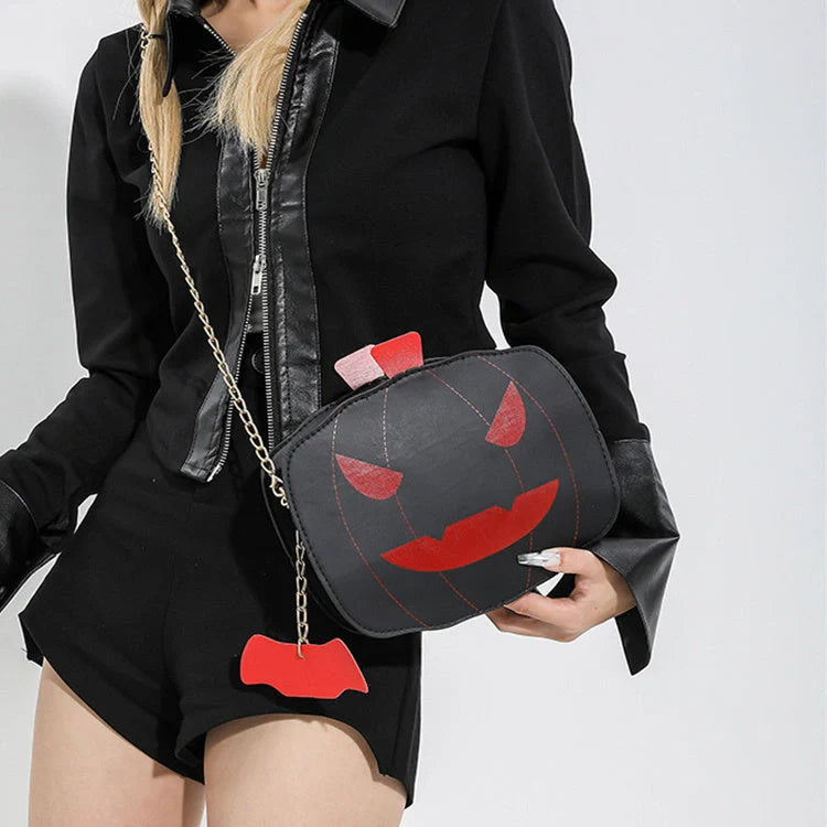 Enchanting Halloween pumpkin-themed shoulder bag in various colours, featuring an adjustable chain strap and trendy urban style
