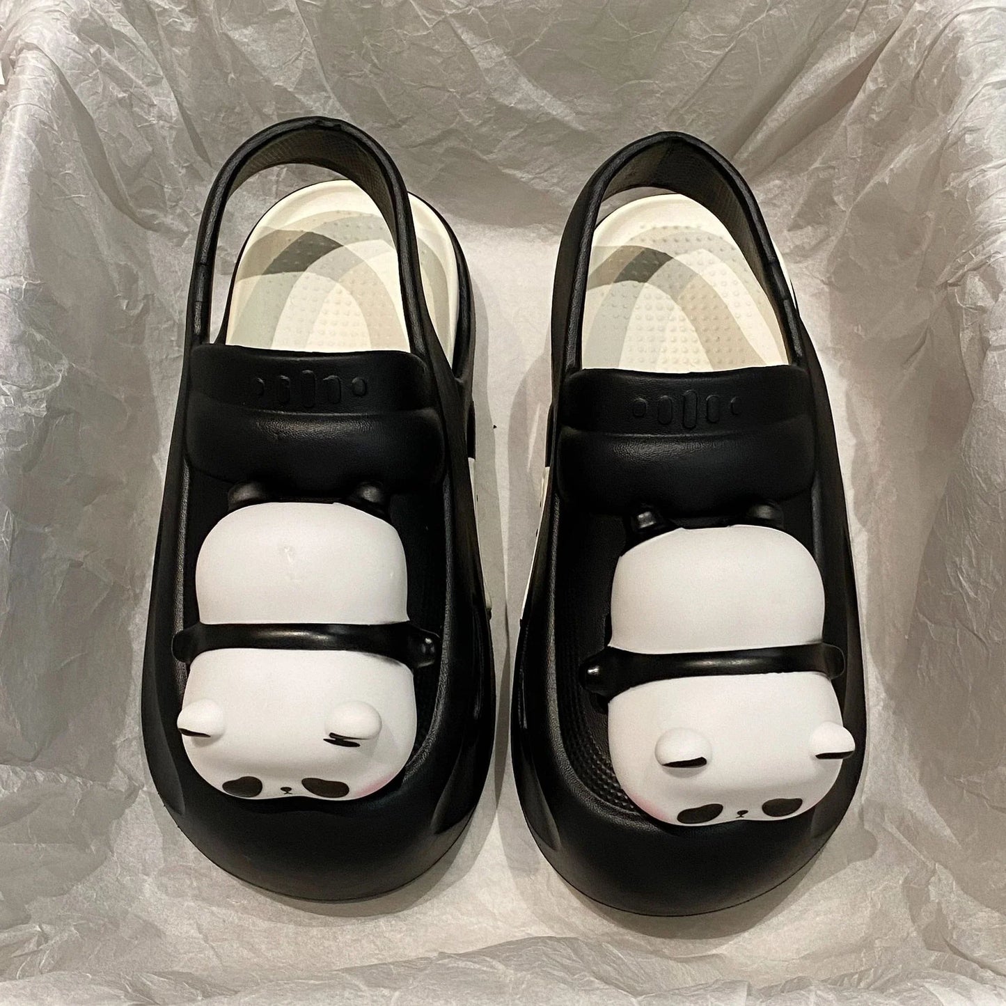 Adorable panda-themed slip-on slippers in various colors and sizes, featuring a lightweight and breathable design for comfortable everyday wear.