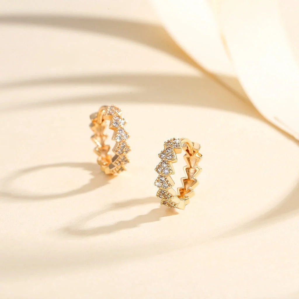 Premium copper-plated gold and zircon stud earrings in a classic design, exuding British elegance and sophistication