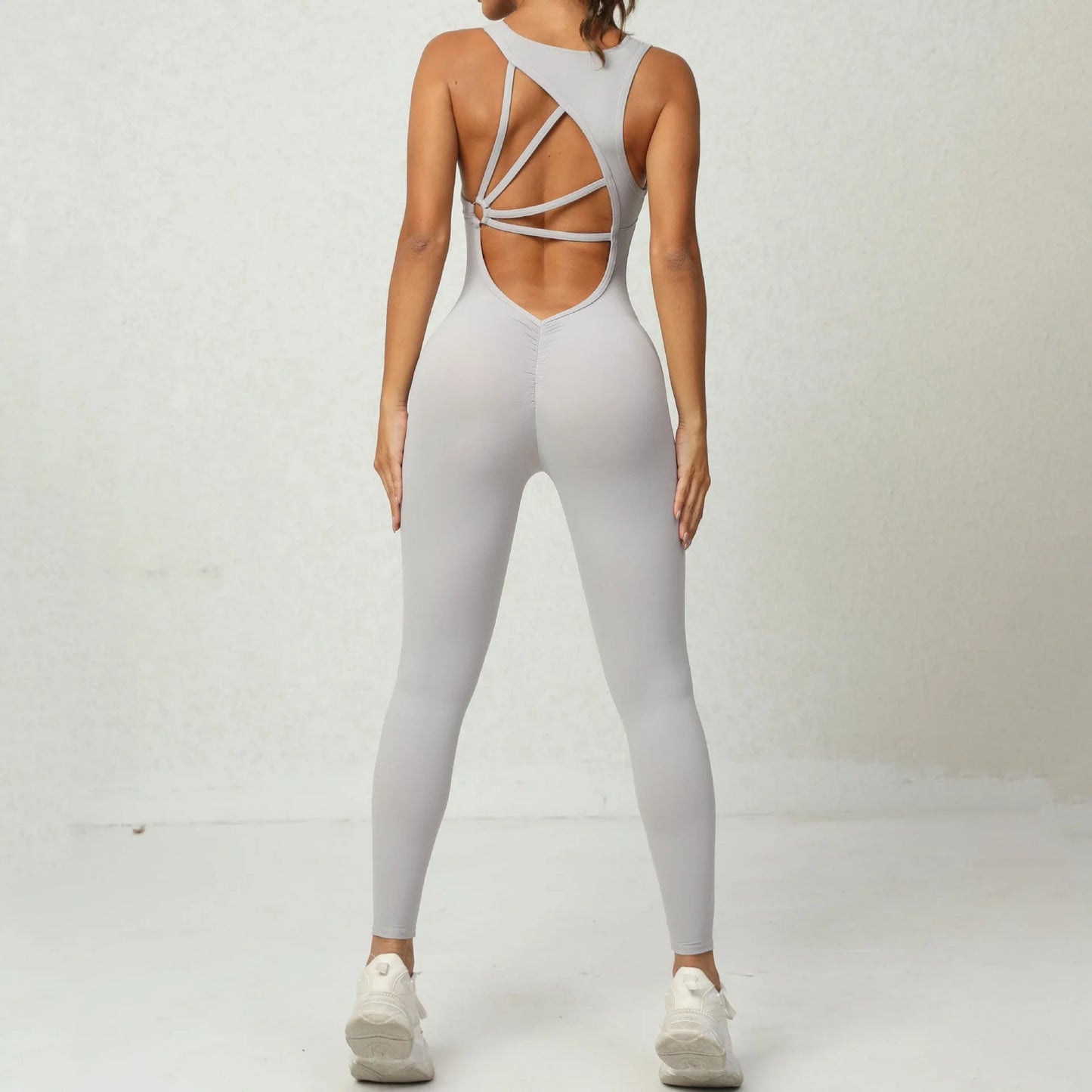 Premium yoga jumpsuit with sleek V-shaped back design, available in a variety of vibrant colors for active lifestyles.