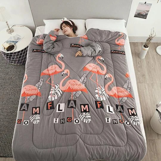 Cozy quilted lounger with sleeves in various colors and sizes, perfect for year-round indoor comfort and relaxation.