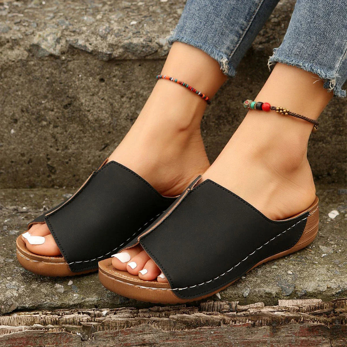 Fashionable wedge sandals in a variety of colors, featuring a peep-toe design and thick, durable soles for comfort and style