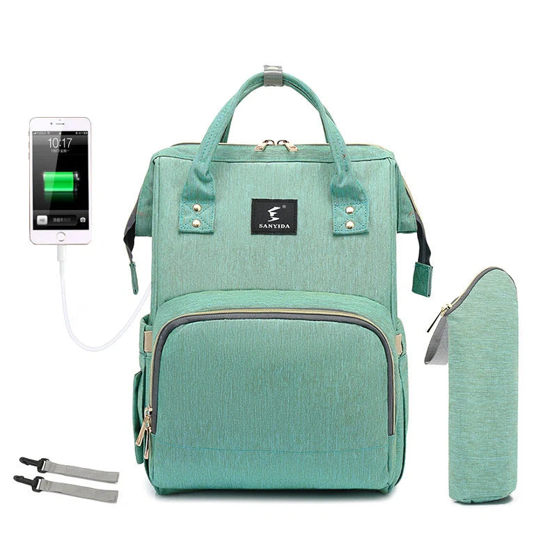 Portable folding crib and mummy bag in green and grey, compact design for baby travel