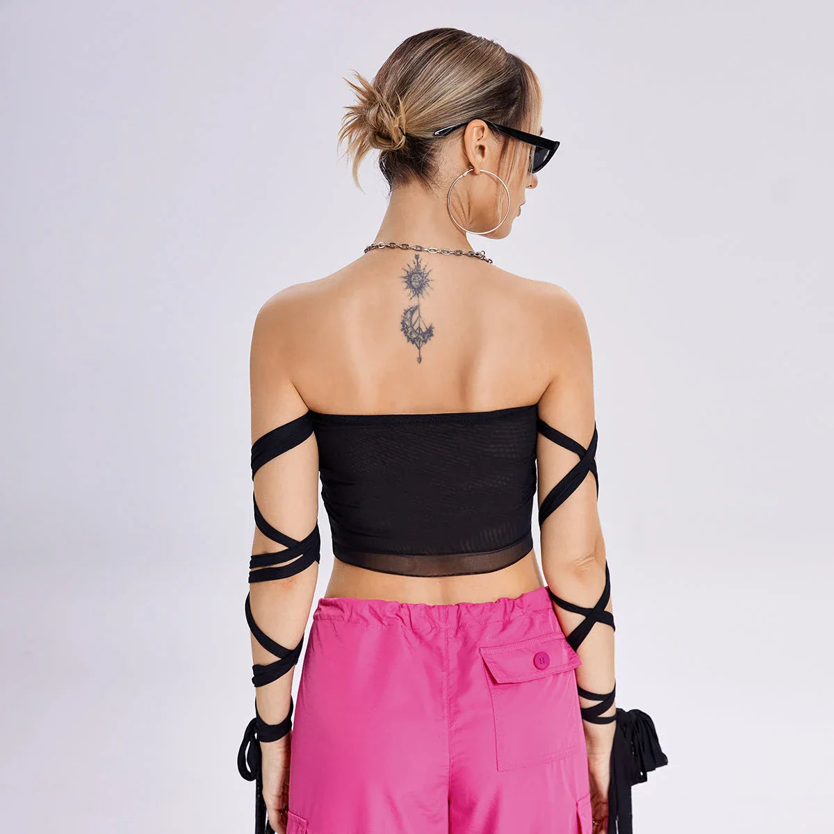Stylish women's tank top with elastic cross-arm straps, available in black color