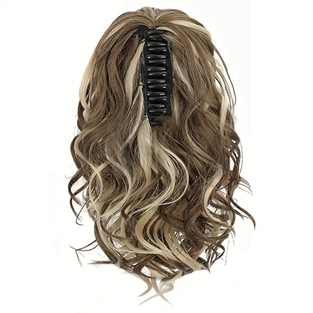 A close-up view of the 12-Inch Short Wavy Claw Clip Ponytail Extension in black, showcasing its natural texture and seamless blending capabilities.