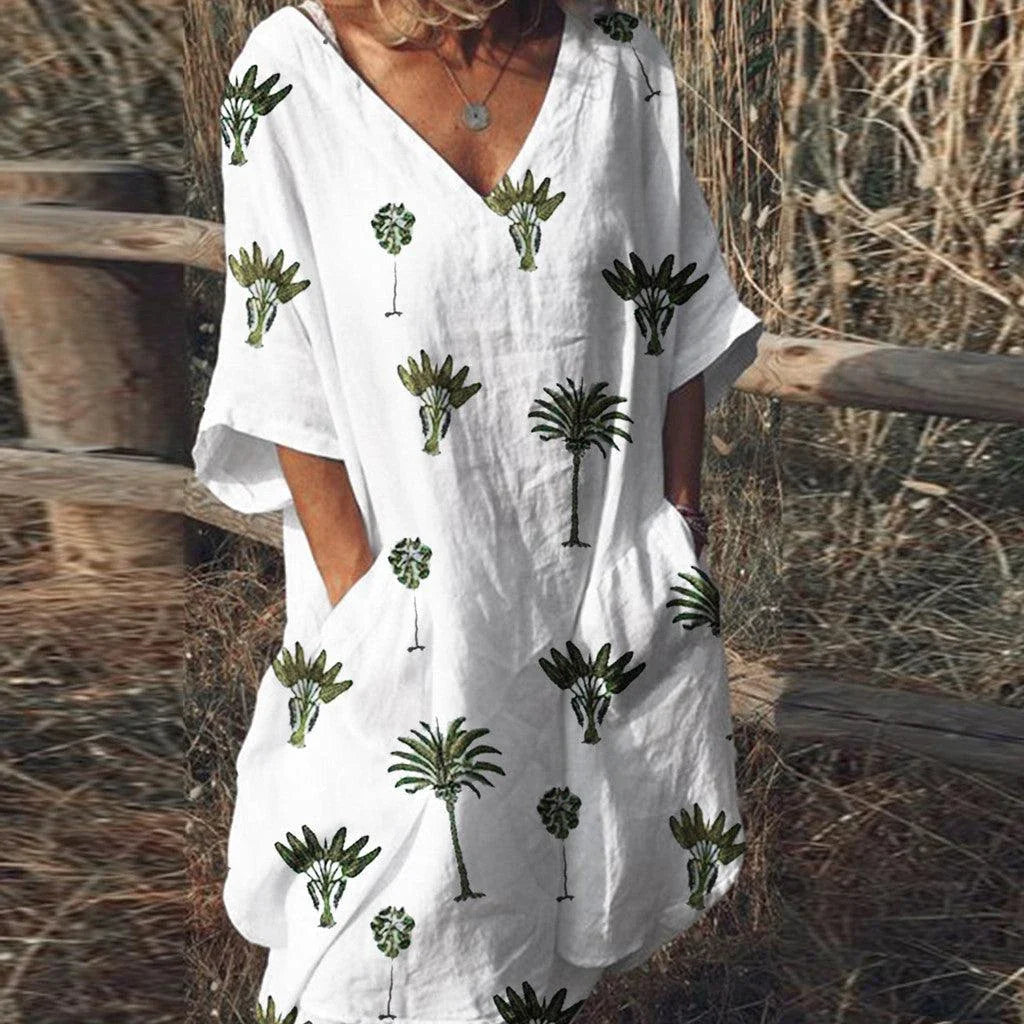Trendha Leaf Print V-Neck Casual Flared Dress in blue with a vibrant leaf pattern, v-neck, and flared skirt design