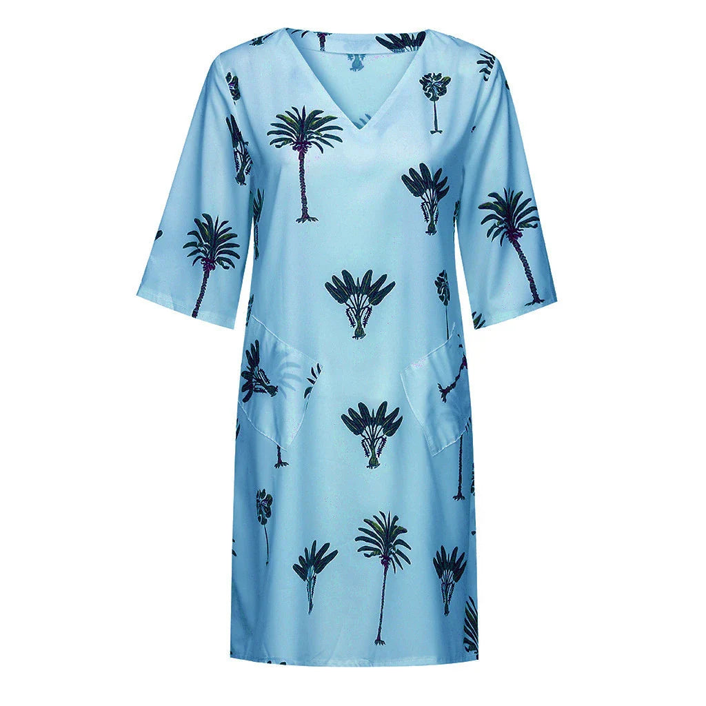 Trendha Leaf Print V-Neck Casual Flared Dress in blue with a vibrant leaf pattern, v-neck, and flared skirt design