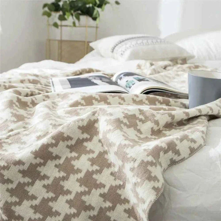 A cosy and stylish houndstooth plaid cotton blanket in various colour combinations, perfect for adding comfort and elegance to any living space.