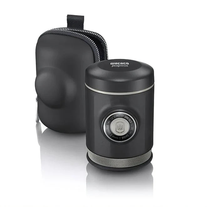 Portable espresso maker with a sleek black design, featuring a naked portafilter and manual operation for crafting premium coffee on the go.