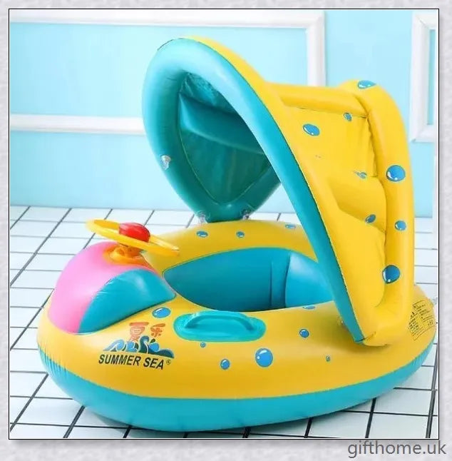A baby swimming in a blue and white clamshell-style inflatable swimming pool float with a sun canopy and steering wheel