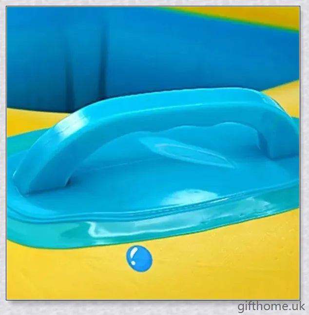 A baby swimming in a blue and white clamshell-style inflatable swimming pool float with a sun canopy and steering wheel