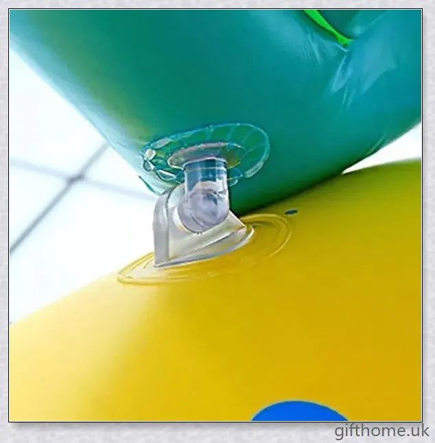 A baby swimming in a blue and white clamshell-style inflatable swimming pool float with a sun canopy and steering wheel