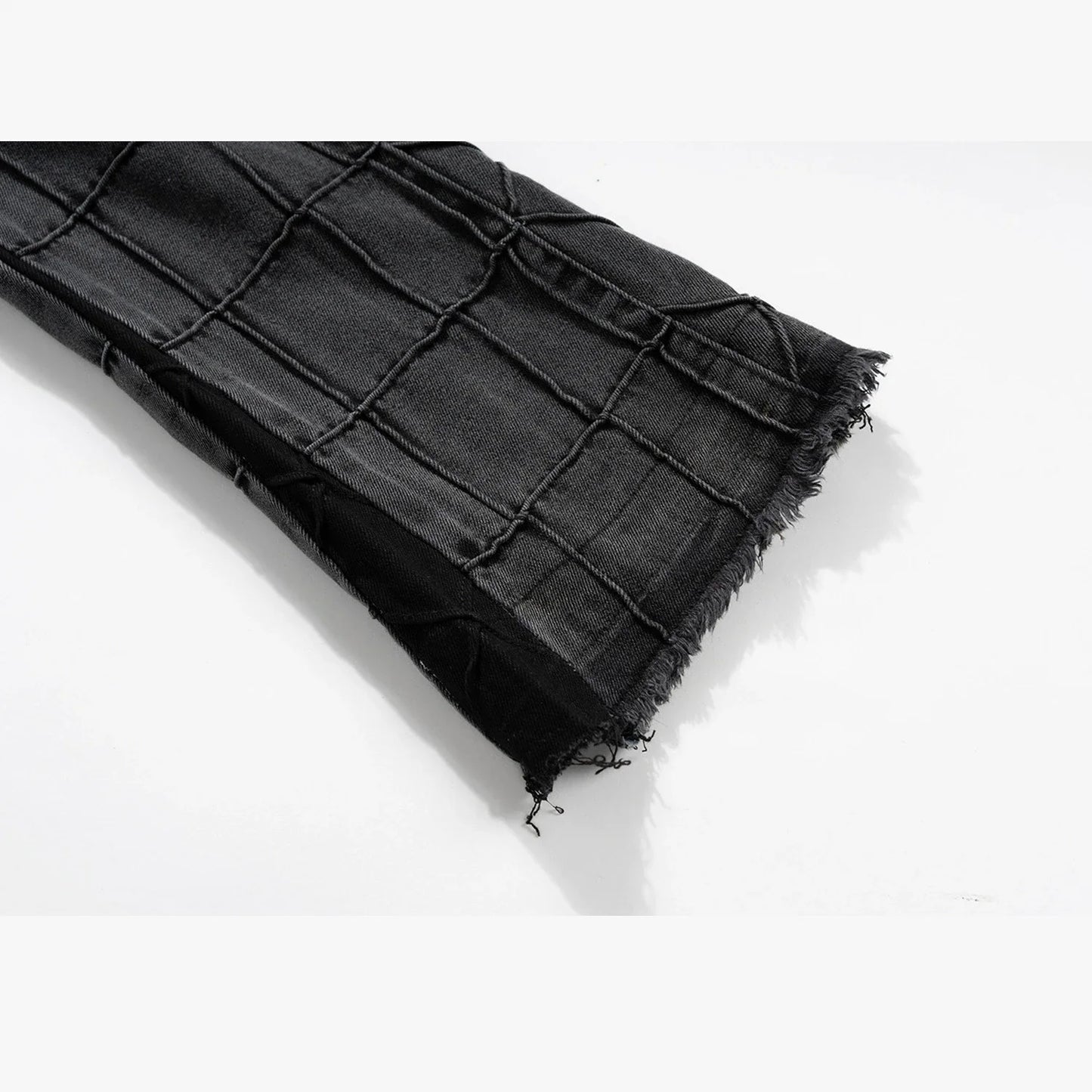 A pair of fashionable waffle-textured denim jeans in black and gray colors, suitable for both men and women.