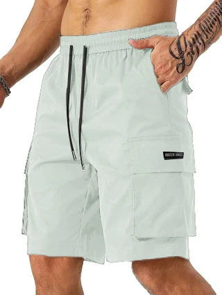 Drawstring waist men's multi-pocket workwear shorts in various colours, designed for comfort and functionality on the job site or for DIY projects.