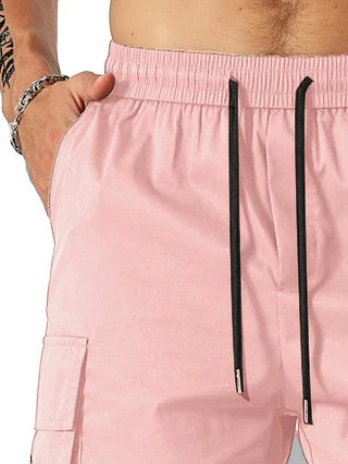 Drawstring waist men's multi-pocket workwear shorts in various colours, designed for comfort and functionality on the job site or for DIY projects.