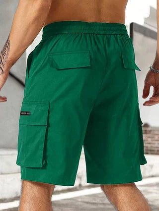 Drawstring waist men's multi-pocket workwear shorts in various colours, designed for comfort and functionality on the job site or for DIY projects.