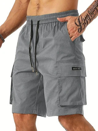 Drawstring waist men's multi-pocket workwear shorts in various colours, designed for comfort and functionality on the job site or for DIY projects.
