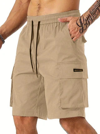 Drawstring waist men's multi-pocket workwear shorts in various colours, designed for comfort and functionality on the job site or for DIY projects.