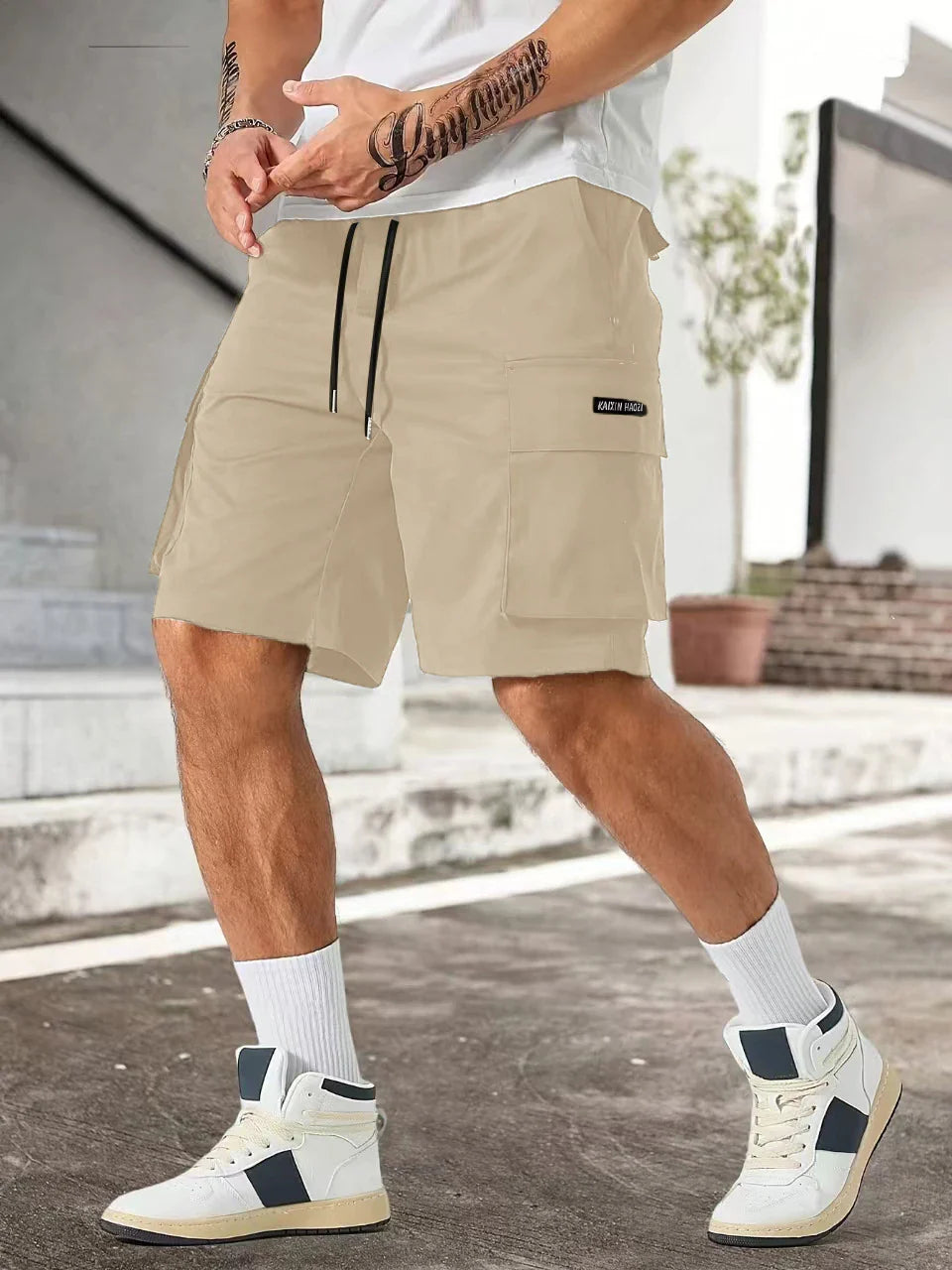 Drawstring waist men's multi-pocket workwear shorts in various colours, designed for comfort and functionality on the job site or for DIY projects.