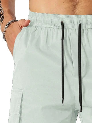 Drawstring waist men's multi-pocket workwear shorts in various colours, designed for comfort and functionality on the job site or for DIY projects.