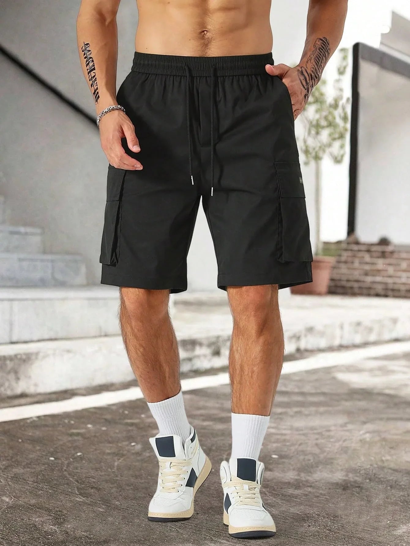 Drawstring waist men's multi-pocket workwear shorts in various colours, designed for comfort and functionality on the job site or for DIY projects.