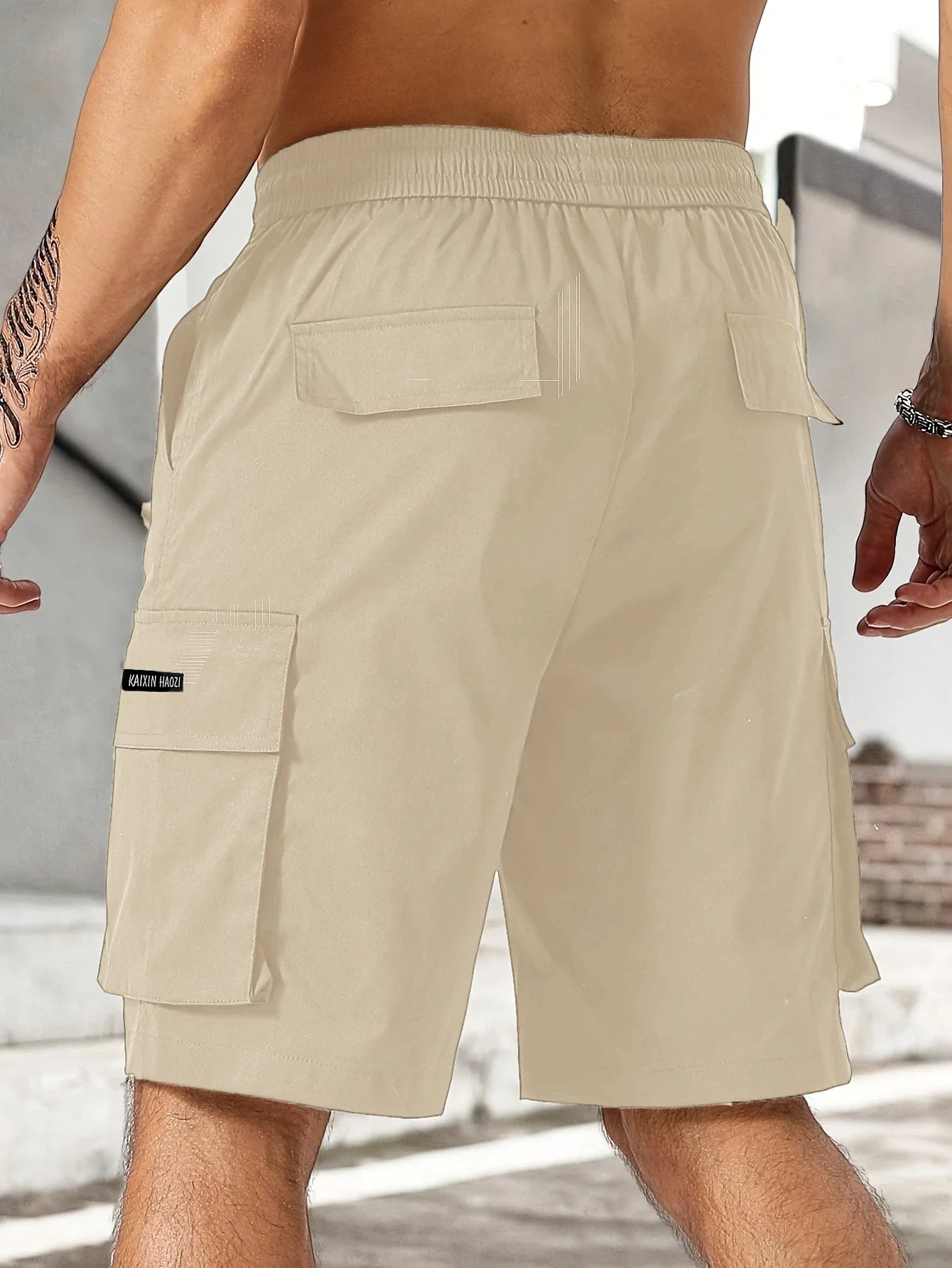 Drawstring waist men's multi-pocket workwear shorts in various colours, designed for comfort and functionality on the job site or for DIY projects.
