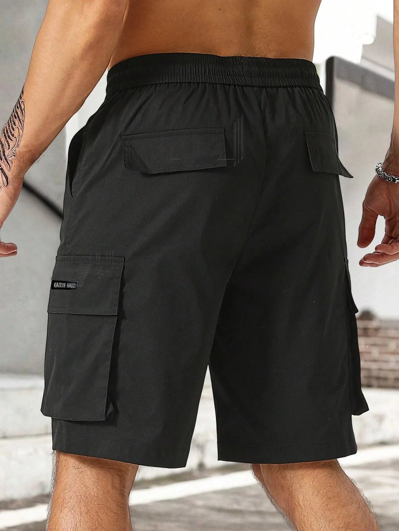 Drawstring waist men's multi-pocket workwear shorts in various colours, designed for comfort and functionality on the job site or for DIY projects.