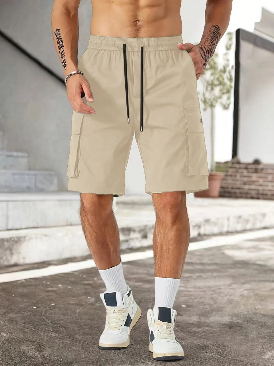 Drawstring waist men's multi-pocket workwear shorts in various colours, designed for comfort and functionality on the job site or for DIY projects.