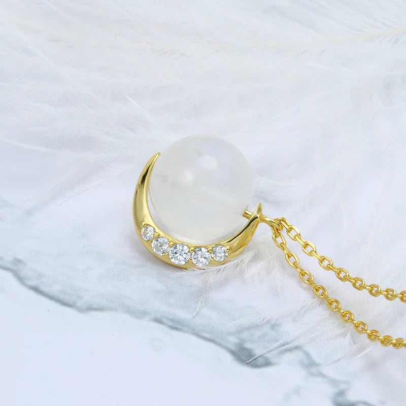 Elegant silver crescent moon necklace with sparkling stones, a timeless celestial accessory