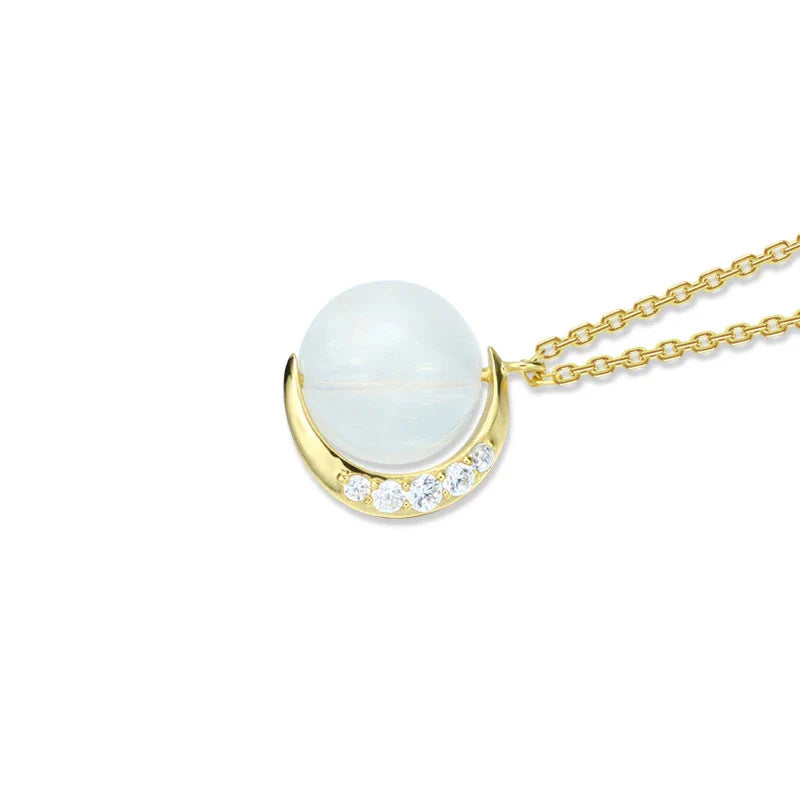 Elegant silver crescent moon necklace with sparkling stones, a timeless celestial accessory