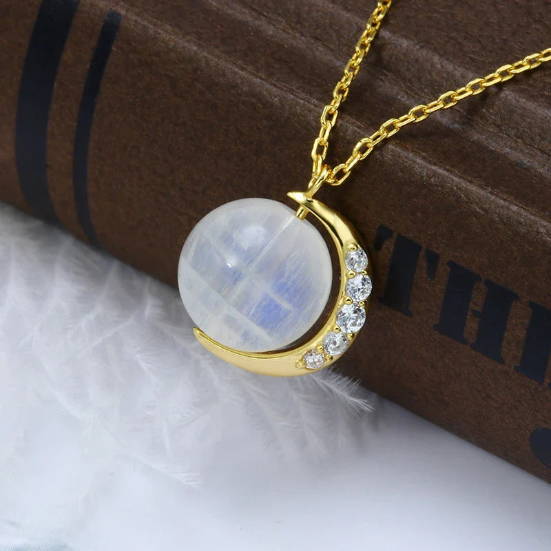 Elegant silver crescent moon necklace with sparkling stones, a timeless celestial accessory