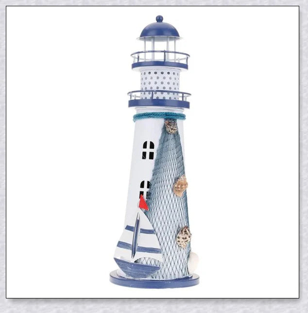 Oceanica LED Lighthouse Lantern Nightlight with nautical details like a small boat, life buoy, and seashells, providing a soft warm glow.