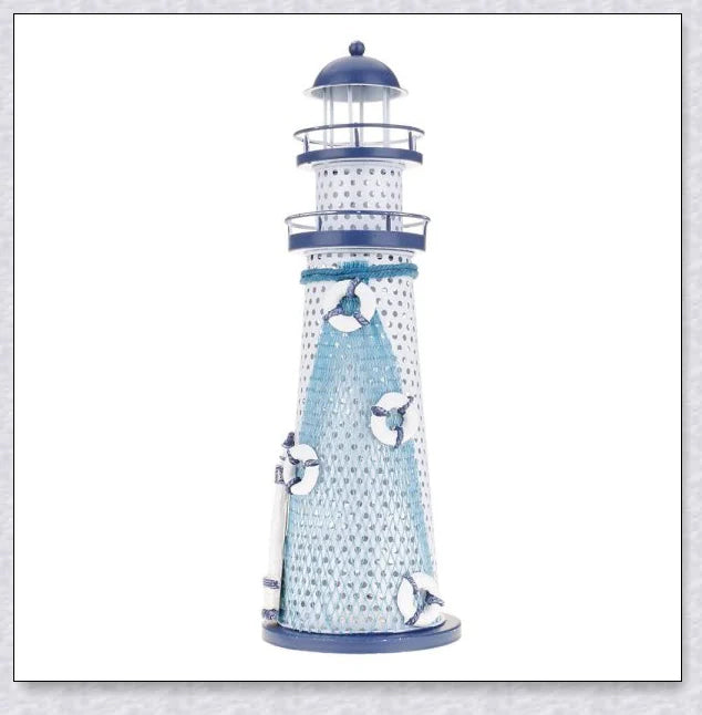 Oceanica LED Lighthouse Lantern Nightlight with nautical details like a small boat, life buoy, and seashells, providing a soft warm glow.